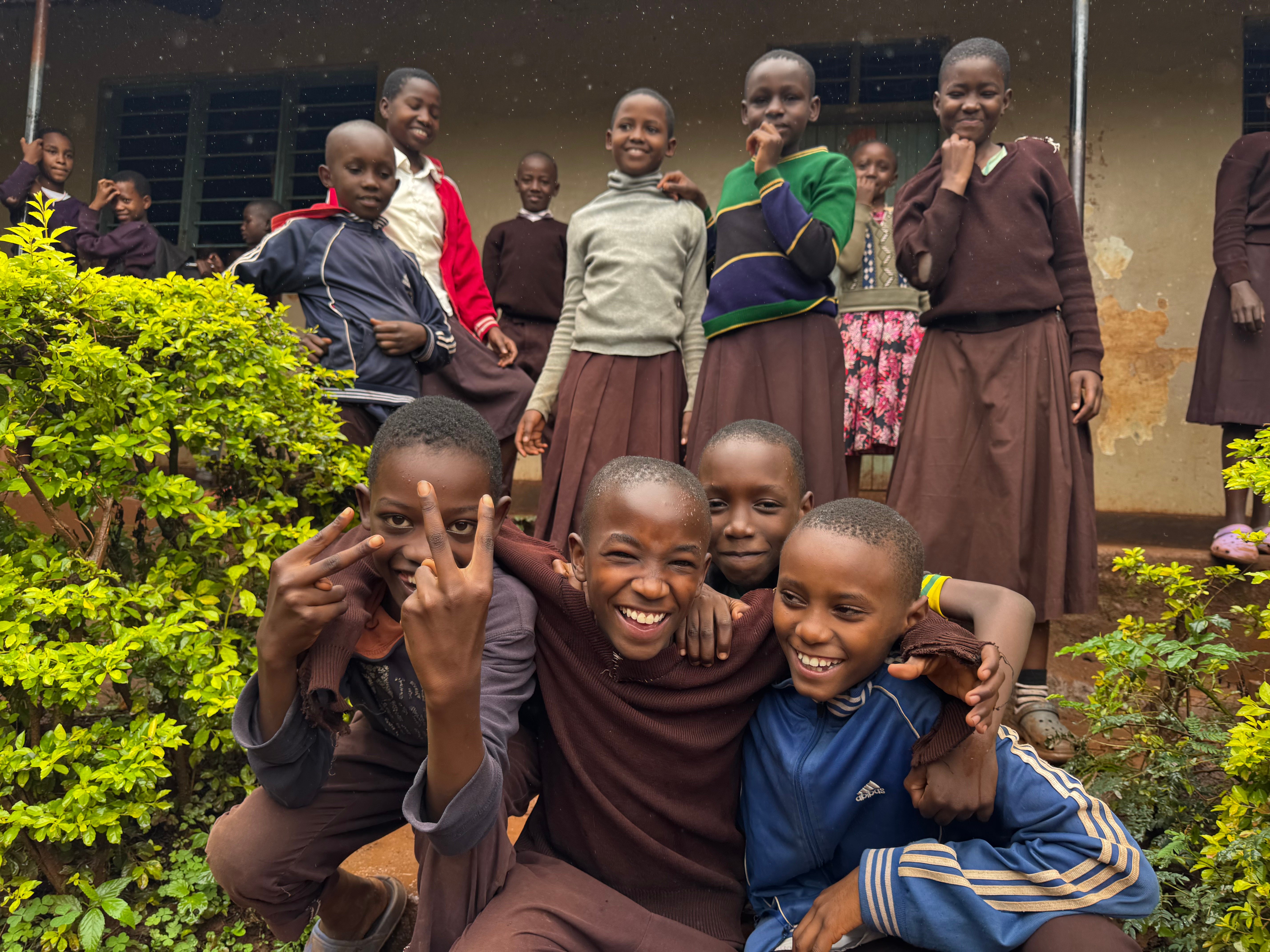 Smiling children from the Uweza Tanzania community
